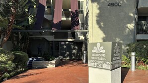 A Windsor Fountains Condominiums sign with a number 4900.