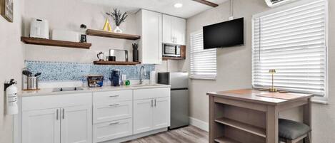 Fridge, microwave, stovetop, coffee/tea maker