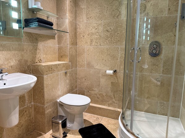 Shower, hair dryer, towels, soap
