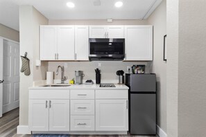 Fridge, microwave, stovetop, coffee/tea maker