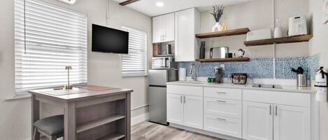 Fridge, microwave, stovetop, coffee/tea maker