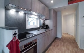 Fridge, microwave, coffee/tea maker, cookware/dishes/utensils