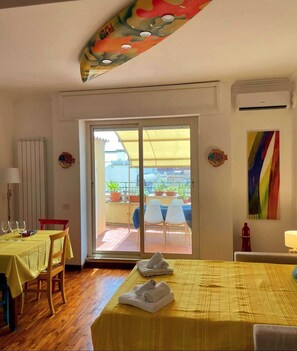 Dining - Penthouse overlooking the rooftops of Anzio's historic buildings, downtown but within walking distance of the beach. (anzio)