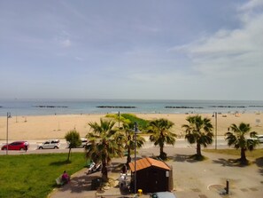 On the beach, sun-loungers