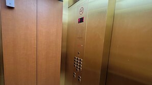 An elevator with a metallic finish, a digital display, and a keypad. - waikiki beach (Honolulu)
