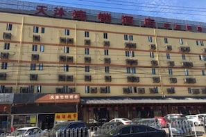 A multi-story hotel with numerous windows and balconies.