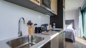 Fridge, microwave, stovetop, coffee/tea maker