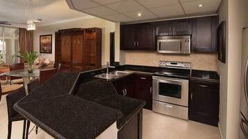 Studio Suite, Kitchen, Poolside | Private kitchen | High chair
