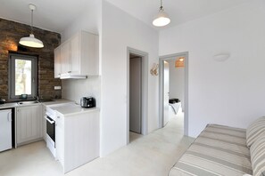 1 bedroom, desk, iron/ironing board, travel crib