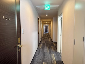 Corridors lead to door 308, offering access to guest rooms.
