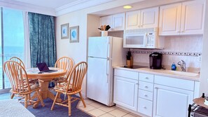 Fridge, microwave, stovetop, coffee/tea maker