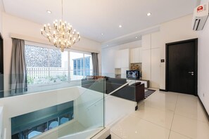 65-inch Smart TV with digital channels, foosball