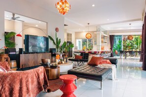 65-inch Smart TV with digital channels, table football