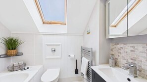 Shower, hair dryer, towels, shampoo