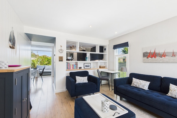 The social heart of this holiday home includes a Smart TV and comfortable seating for four.