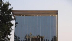 A modern building with a reflective glass facade and the name "Golden Leaf" visible. - Hotel Golden Leaf (Ranchi)