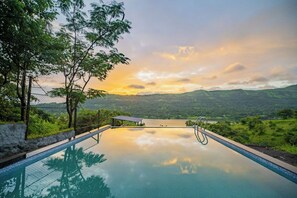 Outdoor pool, open 8:00 AM to 7:00 PM, pool loungers