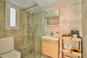 Shower, hair dryer, towels, soap