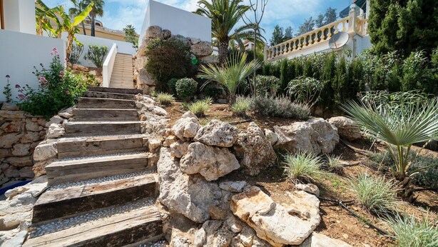 A stone staircase leading to a white building with a balcony. - Modern Stay near Monte Solana (Pedreguer)