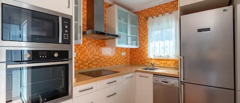 Fridge, stovetop, dining tables