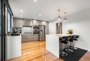 Microwave, dishwasher, coffee/tea maker, cookware/dishes/utensils