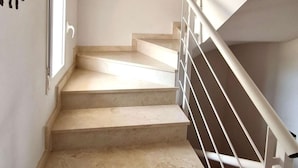 A staircase with a white railing and beige steps. - Bungalow Orihuela Costa Sunset and Pool (Relleu)