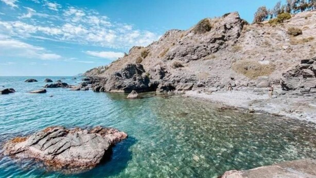 A rocky coastline with clear water and a large rock in the foreground. - Apartment in Salobreña with Sea Views (Salobreña)