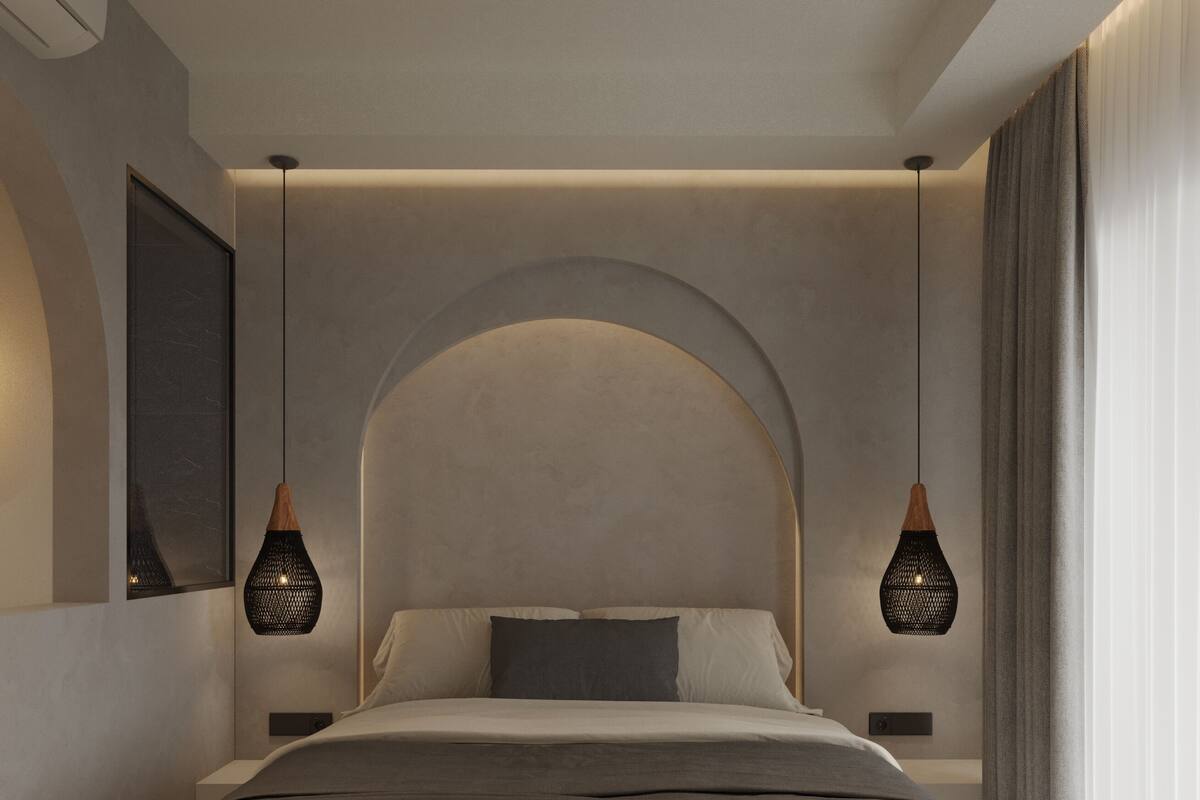 A modern bedroom with a large bed, two pendant lights, and a large window with curtains.