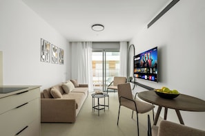 Apartment | Living area | 55-inch Smart TV with cable channels