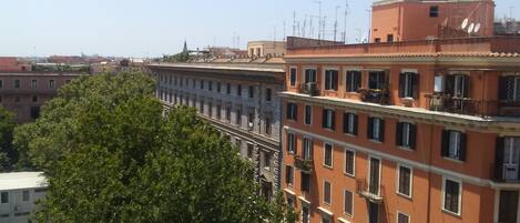 A multi-story building with balconies and a clear view of the surrounding area.