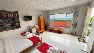 Executive Quadruple Room, Garden View | Hypo-allergenic bedding, memory-foam beds, in-room safe, desk