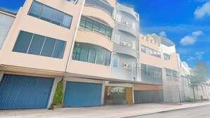 A multi-story building with a modern design, featuring large windows and balconies. - Hotel O Krekot Residence Pasar Baru (Jakarta)