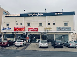 Home to a service department, bank, and garden center, this building offers a convenient location for travelers.