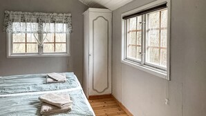 A room with a bed, a window, and a door. - 1 bedroom gorgeous home in Romakloster (Romakloster)