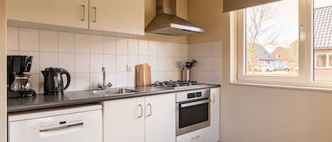 Fridge, microwave, stovetop, coffee/tea maker
