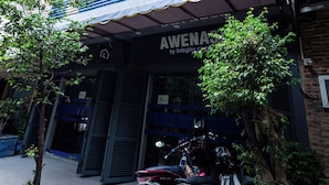 A building with a storefront labeled "Awenas by Living Inn." - Awenasa by Livinginn (Ho Chi Minh City)