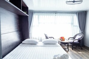 Deluxe Double Room, City View | Desk, laptop workspace, blackout curtains, iron/ironing board - Awenasa by Livinginn (Ho Chi Minh City)