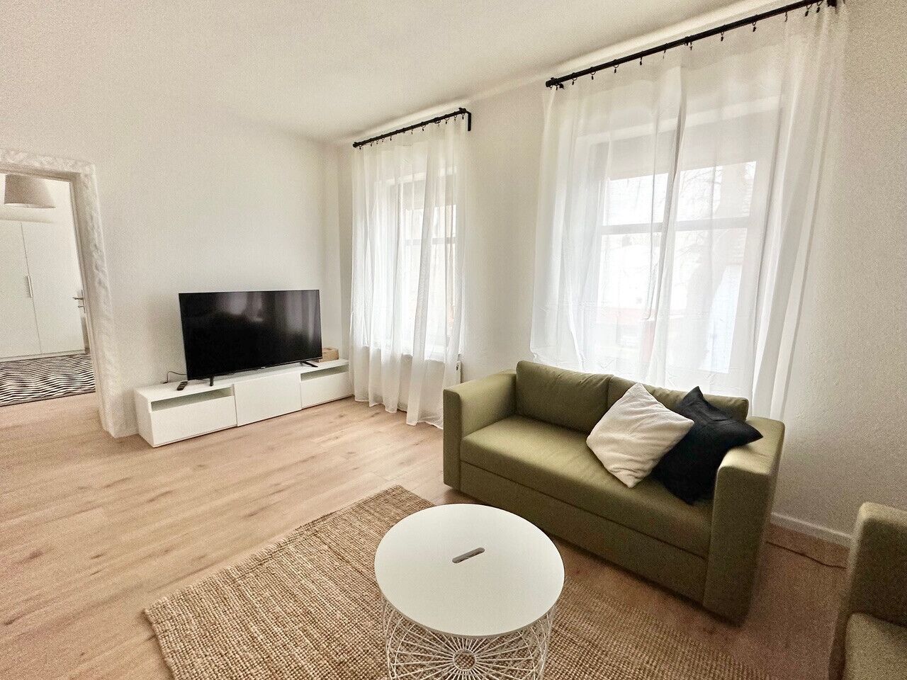 Apartment, 2 Bedrooms (378165) | Living area | 60-inch flat-screen TV with cable channels