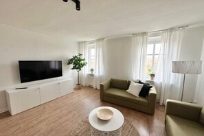 Apartment, 2 Bedrooms (360762) | Living area | 60-inch flat-screen TV with cable channels
