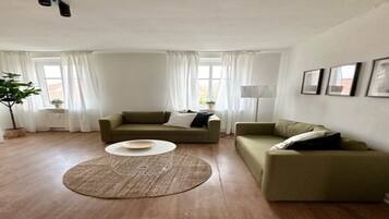 Apartment, 2 Bedrooms (360762) | Living area | 60-inch flat-screen TV with cable channels