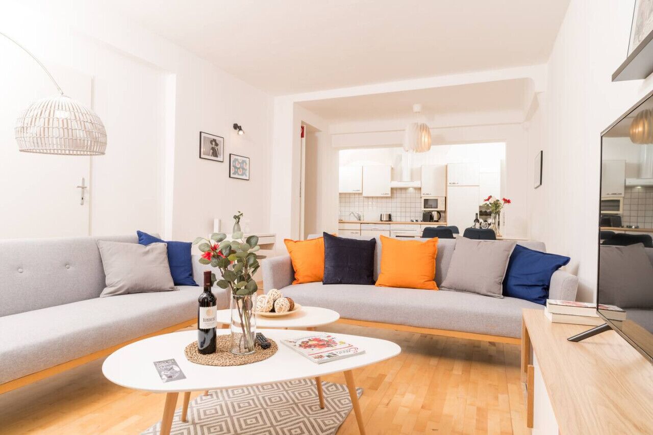 Apartment, 1 Bedroom (206298) | Living area | 60-inch flat-screen TV with cable channels