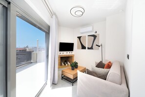 Panoramic Apartment, City View | Living area | 43-inch Smart TV with cable channels - Acropolis View - Stylish City Penthouse (Athens)