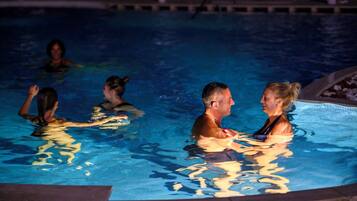 Seasonal outdoor pool, open 9:00 AM to 7:00 PM, pool umbrellas