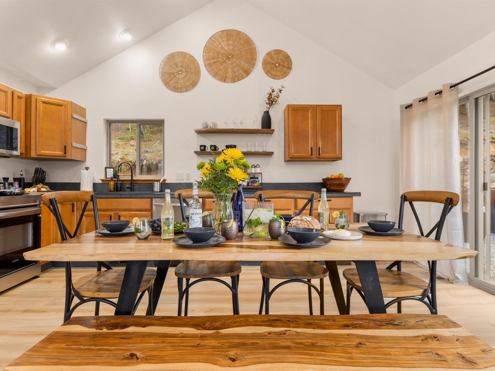 The dining table set and the kitchen steps away. Group dinners at Lakeview feel less like cooking and more like something worth remembering.