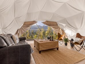 Inside the Lakeview Lodge Geo Dome. Climate controlled year round, fully furnished, and that panoramic window bringing the Colorado mountains right into the room with you. - Geo Dome Group Retreat | 3 King Beds & Game Room (Bailey)
