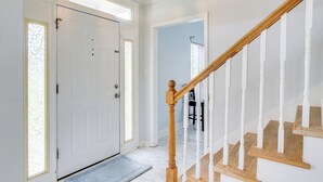 A staircase with wooden balusters and a white handrail leading to a landing. - 10 Mi to Augusta: Georgia Family Home w/ Yard (Augusta)