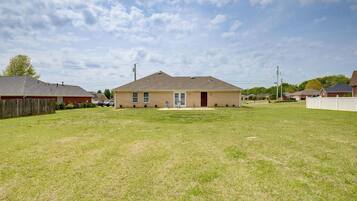 A single-story house with a front yard, a garage, and a small porch.