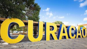 Large yellow and blue letters spelling "CURACAO" on a paved surface. - Chic City View Residence by the Bay (Willemstad)