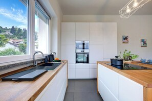 Family Apartment, Multiple Bedrooms, 2 Bathrooms, Lakeside (Suono del Lago 100m from Lake) | Private kitchen | Fridge, oven, stovetop, dishwasher - Suono del Lago 100m From Lake (Meina)