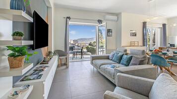 Family Apartment, 2 Bedrooms, 2 Bathrooms, Lakeside (Suono del Lago 100m from Lake) | Living area | Smart TV